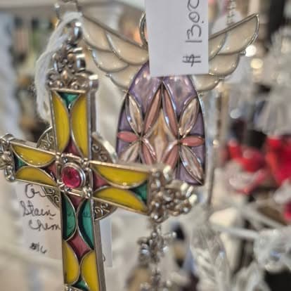 A cross with a price tag on it.